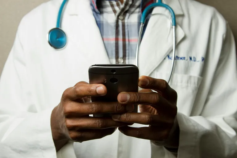 Medical professional using AI-assisted technology